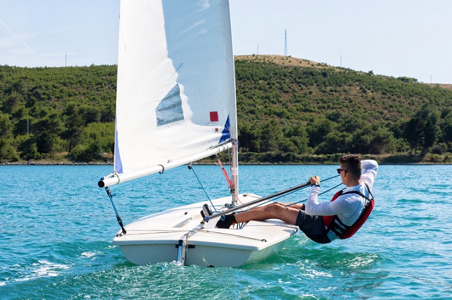 Boy sailing a boat