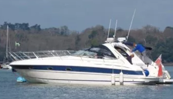 couple on a motor boat near shore