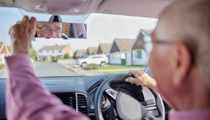 Picture of man reversing car